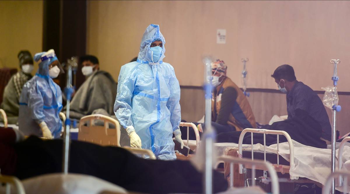Covid-19 Omicron Variant Jan 16 highlights: A health worker interacts with Covid-19 patients inside the Shehnai Banquet Hall, a COVID-19 care facility, during the third wave of the coronavirus, in New Delhi. (PTI Photo) Covid-19 Omicron Variant Jan 16 highlights: A health worker interacts with Covid-19 patients inside the Shehnai Banquet Hall, a COVID-19 care facility, during the third wave of the coronavirus, in New Delhi. (PTI Photo)