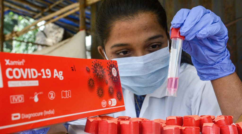 Omicron Cases in India Live: Covid-19 Booster Vaccine Registration Live Updates, Coronavirus Lockdown, Night Curfew Guidelines, Restrictions Latest Update, Covid-19 Third Wave in India Live Updates: A health worker takes swab sample of a woman for COVID-19 test, amid a surge in cases, in Jammu, 2022