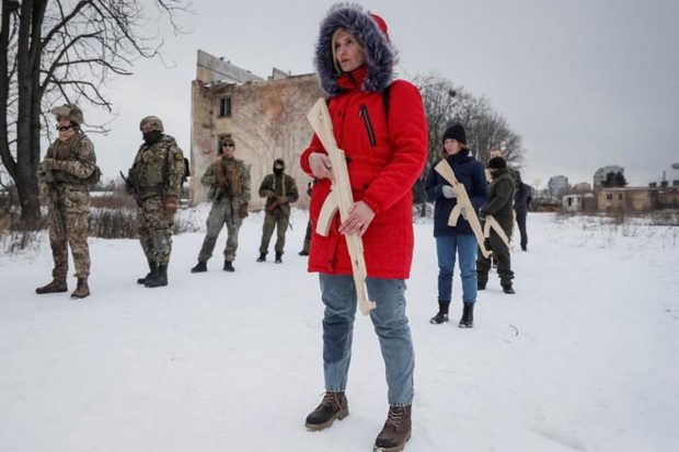 People take part in a military exercise for civilians conducted by veterans of the Ukrainian National Guard Azov battalion, amid threat of Russian invasion, in Kyiv, Ukraine. (Reuters Photo)