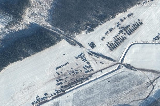 Satellite image shows the troops and equipment in Rechitsa, Belarus, north of the border with Ukraine. (AP Photo)