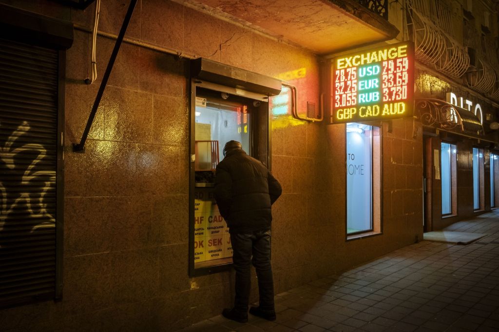 A customer at a currency exchange office in Kyiv, Ukraine, on Tuesday, Feb. 22, 2022. Russia's President Vladimir Putin announced he's recognizing two self-proclaimed separatist republics in eastern Ukraine. (File Photo: Bloomberg) A customer at a currency exchange office in Kyiv, Ukraine, on Tuesday, Feb. 22, 2022. Russia's President Vladimir Putin announced he's recognizing two self-proclaimed separatist republics in eastern Ukraine. (File Photo: Bloomberg)