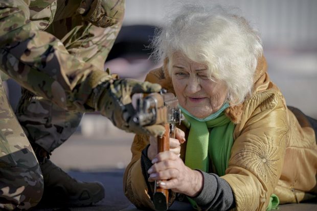 Valentyna Konstantynovska, 79 years-old, holds a weapon during a basic combat training for civilians, organized by the Special Forces Unit Azov, of Ukraine's National Guard, in Mariupol, Donetsk region, eastern Ukraine. (AP Photo)