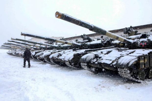 A service member walks past tanks of a mechanized brigade of the Ukrainian Armed Forces during military exercises outside Kharkiv, Ukraine. (Reuters Photo)