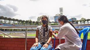 Bengaluru: A health worker administers a dose of COVID-19 vaccine to a sportsperson, at Kanteerava Stadium in Bengaluru, Thursday, June 10, 2021. (PTI Photo/Shailendra Bhojak)(PTI06_10_2021_000146A)