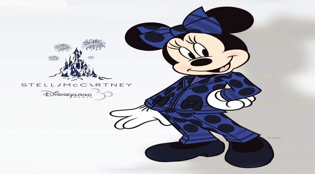 Minnie has worn a white pair of sailor trousers in 2019 as 'Captain Minnie' onboard a Disney Cruise Line. This time the red polka dress is swapped with a dark blue pantsuit