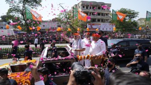 Prime Minister Narendra Modi waves during a road show in Ahmedabad (AP Image)