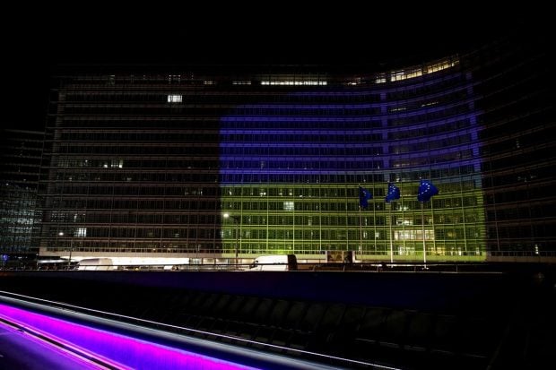 The European Commission building is illuminated in the colours of the Ukrainian flag, in Brussels, Belgium. (Reuters Photo)