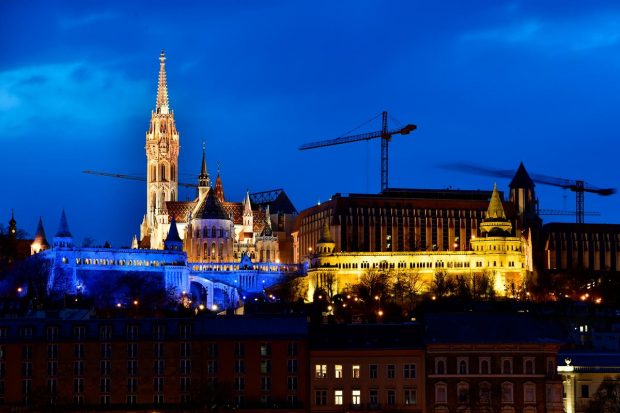 The iconic Fisherman's Bastion in the Buda castle is lit up in the colours of the Ukrainian flag, after Russia launched a massive military operation against Ukraine, in Budapest, Hungary. (Reuters Photo)