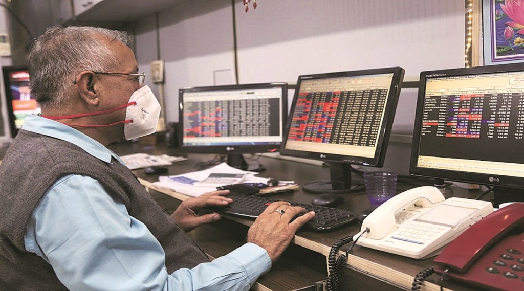 A stock broker at Northern Stock Exchange wearing mask due to Corona Virus threat in Sector 17 Chandigarh on Tuesday, March 17 2020. Express photo by Jaipal Singh A stock broker at Northern Stock Exchange wearing mask due to Corona Virus threat in Sector 17 Chandigarh on Tuesday, March 17 2020. Express photo by Jaipal Singh