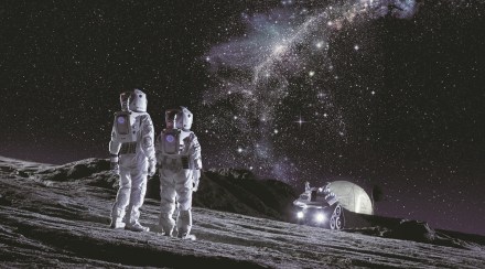 Two Astronauts in Space Suits Stand on the Planet and Looking at the The Milky Way Galaxy. In the Background Lunar Base with Geodesic Dome. Moon Colonization and Space Travel Concept.