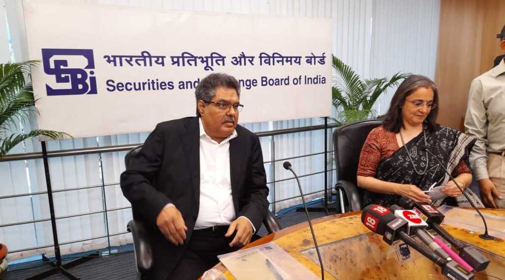 Outgoing SEBI Chairman Ajay Tyagi (left) and incoming head Madhabi Puri BUch (right) at the handing over ceremony Wednesday. (Express photo: Pradip Das)