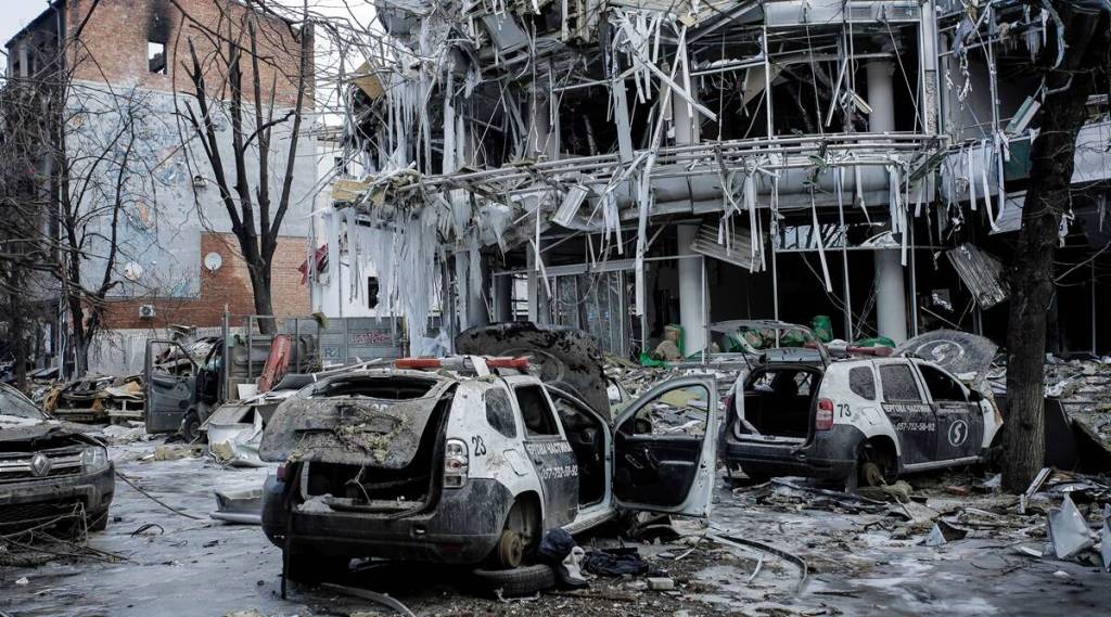 Damaged vehicels sit among debris in Kharkic city centre in Ukraine. (AP News)