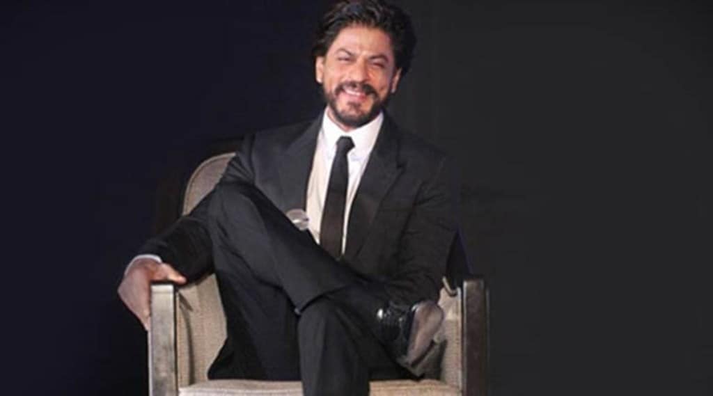 During the session, a user tweeted a picture of a group of fans, who arrived outside the star's bungalow Mannat with a placard thanking him for the film announcement. (IE Photo)
