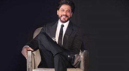 During the session, a user tweeted a picture of a group of fans, who arrived outside the star's bungalow Mannat with a placard thanking him for the film announcement. (IE Photo)
