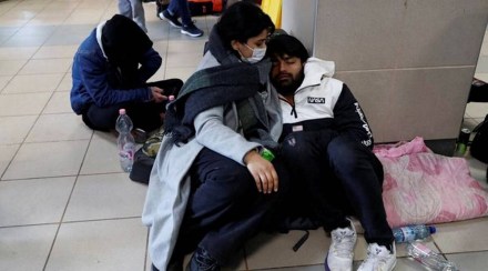 Indian students rest at teh floor of a train station after fleeing Ukraine (Reuters image)