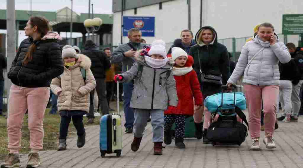 People arrive at the border crossing between Poland and Ukraine, after Russia launched a massive military operation against Ukraine, in Medyka, Poland, February 25, 2022. REUTERS/Kacper Pempel