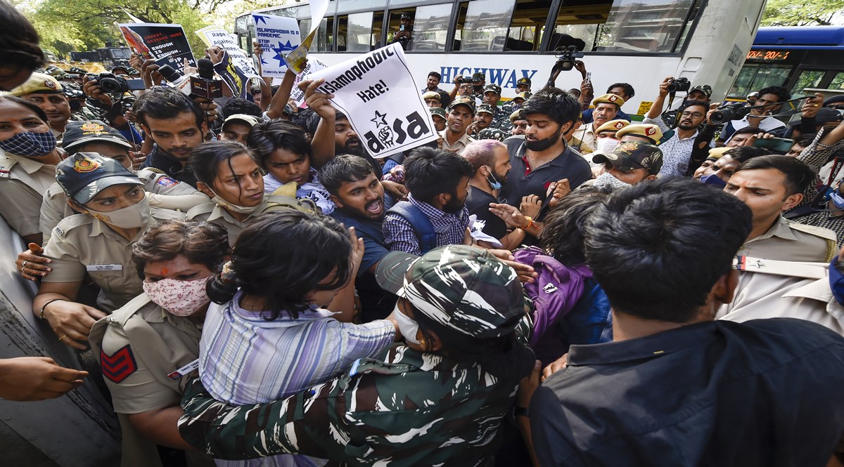 Police detain activists of All India Students' Association (AISA) during a protest demanding the arrest of Bajrang Muni, who allegedly made rape threats, outside UP Bhawan in New Delhi (Image: PTI) Police detain activists of All India Students' Association (AISA) during a protest demanding the arrest of Bajrang Muni, who allegedly made rape threats, outside UP Bhawan in New Delhi (Image: PTI)