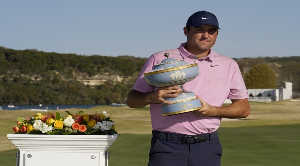 Scottie Scheffler holds the trophy after winning the Dell Technologies Match Play Championship golf tournament (AP Image)
