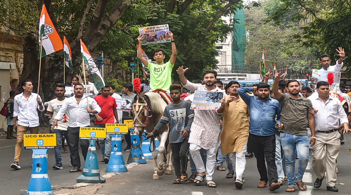 Congress workers ride horses and participate in a march towards West Bengal Governor's residence to protest over the hike in prices of petrol, diesel and LPG cylinders, in Kolkata (PTI Image)