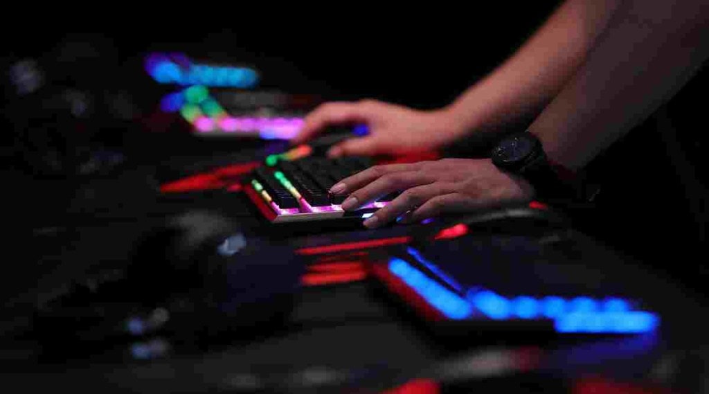 A gamer uses an illuminated keyboard to play a computer game at the Gamescom gaming industry event in Cologne, Germany, on Tuesday, Aug. 21, 2018. (Photographer: Krisztian Bocsi/Bloomberg)