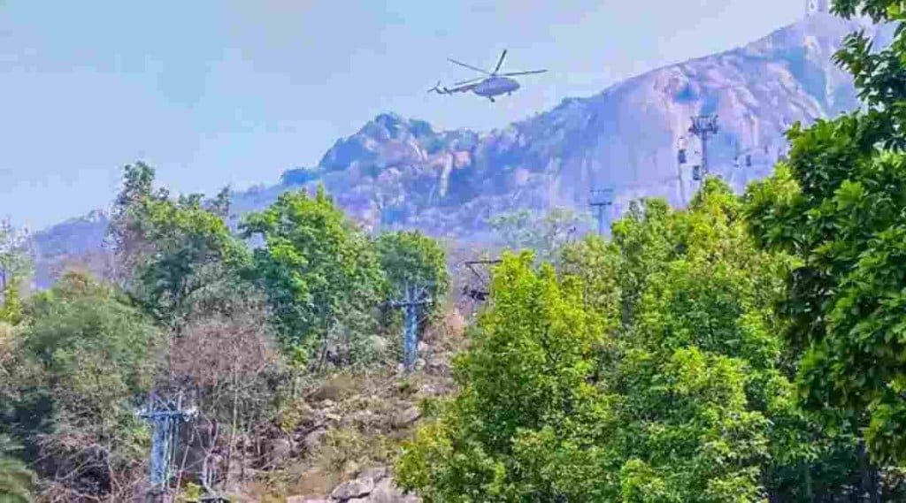 Rescue work under progress by Indian Air Force (IAF) and National Disaster Response Force (NDRF) at Trikut Hill after a collision of cable cars, in Deogar district. (PTI)