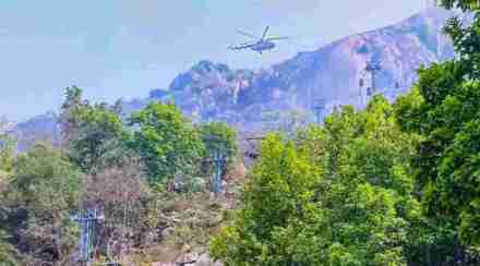 Rescue work under progress by Indian Air Force (IAF) and National Disaster Response Force (NDRF) at Trikut Hill after a collision of cable cars, in Deogar district. (PTI)