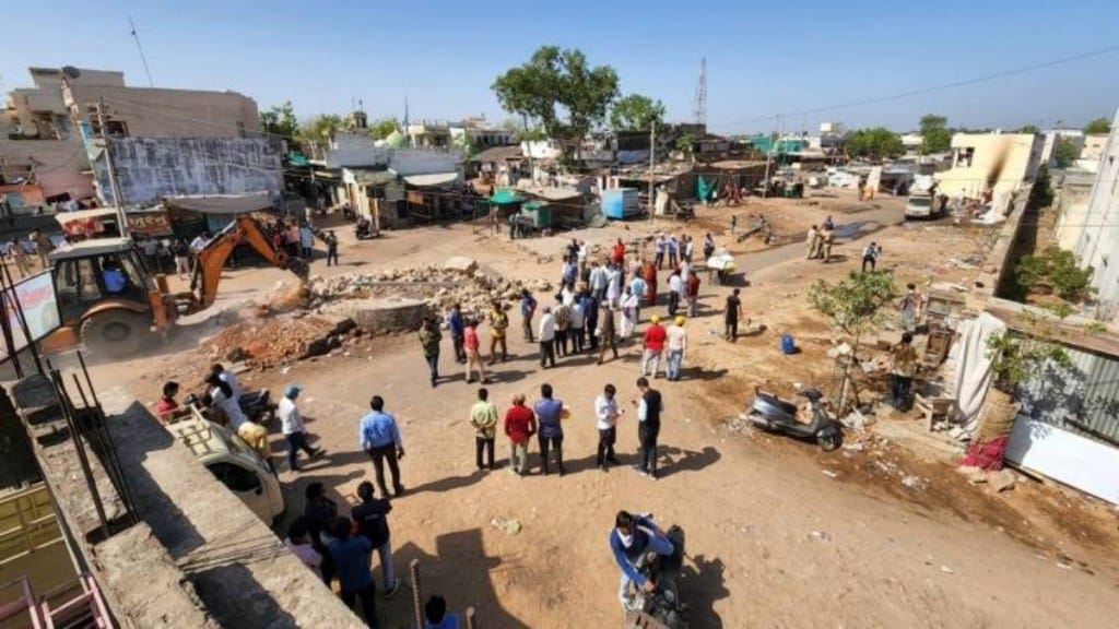 Bulldozers were being used to remove encroachments in Chhapariya locality of Himmatnagar city in Sabarkantha district. (Express Photo)