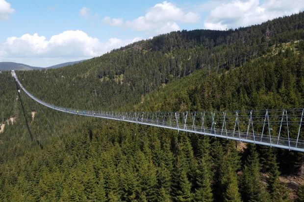 It connects two ridges of the mountains and hangs up to 95 meters (312 feet) above the valley below. (Reuters Photo)