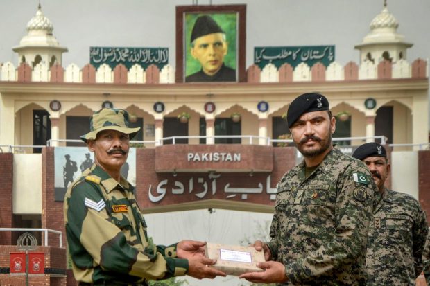 The troops of BSF & Pak Rangers today exchanged sweets on the occasion Eid at various BOPs along IB under Jammu frontier in a very cordial atmosphere. (PTI Photo)