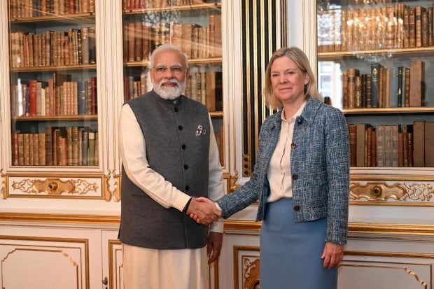 Prime Minister Narendra Modi and Sweden's Prime Minister Magdalena Andersson shake hands prior to a meeting, at Christiansborg Castle, in Copenhagen, Denmark. (Reuters Photo)