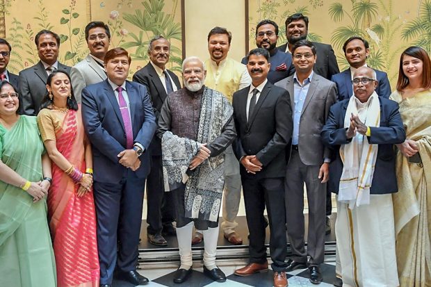 Prime Minister Narendra Modi in a group photograph with the Indian diaspora, in Berlin, Germany. (PIB/PTI Photo)