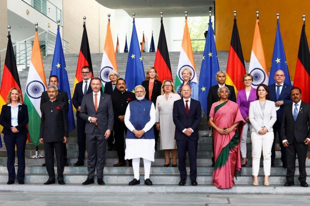 German Chancellor Olaf Scholz and Prime Minister Narendra Modi along with Indian and German Ministers pose for a family photo on the day of the German-Indian government consultations at the Chancellery in Berlin, Germany. (Reuters Photo)