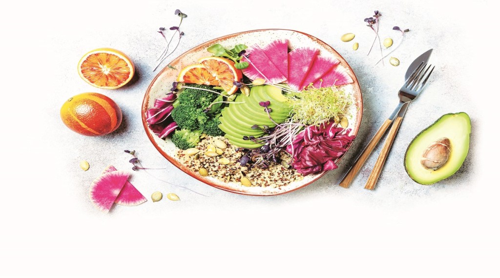 Vegan, detox Buddha bowl with quinoa, micro greens, avocado, blood orange, broccoli, watermelon radish, alfalfa seed sprouts. Top view, flat lay, copy space