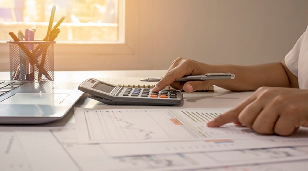 Close-up of businessmen or accountants holding a pen and pressing on the calculator to calculate business information, accounting documents, business ideas. Close-up of businessmen or accountants holding a pen and pressing on the calculator to calculate business information, accounting documents, business ideas.