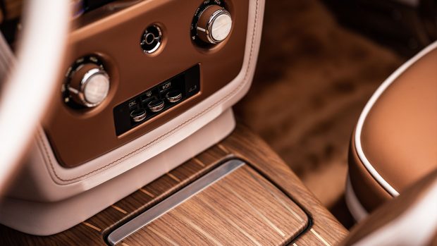 To complement the warm exterior tones, the interior is also lined with a combination of cognac and oyster-coloured leathers and Royal Walnut veneer, with rose gold and mother-of-pearl accents throughout. The transmission tunnel is formed from Royal Walnut veneer with rose gold pinstripes to match the rear deck of the Boat Tail.