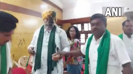 The 30-second video tweeted by news agency ANI shows black ink thrown on Tikait's face, following which a scuffle breaks among those attending the event. The 30-second video tweeted by news agency ANI shows black ink thrown on Tikait's face, following which a scuffle breaks among those attending the event.