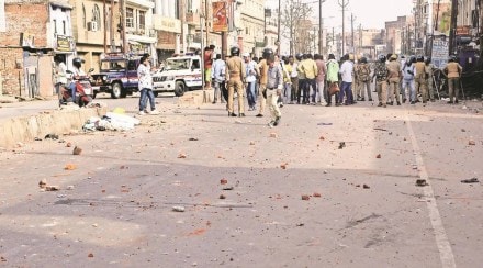 Police in action after the clash between two comunities at Nai Sadak area of Kanpur on Friday. (Express photo)