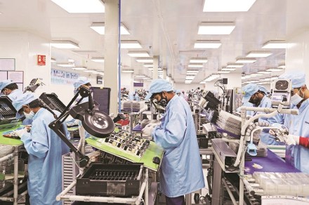 Workers assemble mobile phones at a Dixon Technologies factory in Noida, Uttar Pradesh, India, on Thursday, Jan. 28, 2021. Dixon boasts a market value of more than $2.5 billion and the capacity to produce about 50 million smartphones this year. Photographer: Anindito Mukherjee/Bloomberg Workers assemble mobile phones at a Dixon Technologies factory in Noida, Uttar Pradesh, India, on Thursday, Jan. 28, 2021. Dixon boasts a market value of more than $2.5 billion and the capacity to produce about 50 million smartphones this year. Photographer: Anindito Mukherjee/Bloomberg