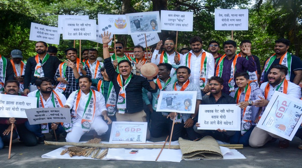 Nationalist Youth Congress workers stage a protest against fuel price hike and inflation in Thane. (PTI) Nationalist Youth Congress workers stage a protest against fuel price hike and inflation in Thane. (PTI)