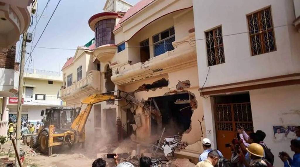 A bulldozer being used to demolish the residence of Javed Ahmed, in UP's Prayagraj. (PTI, file)