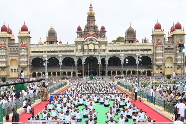 The assembled crowd follows Prime Minister Narendra Modi during the International Day of Yoga event in Mysuru. (Twitter/Narendra Modi)