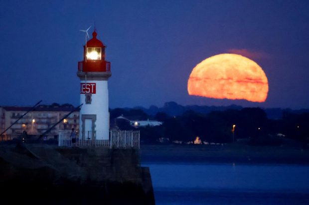 The closer proximity to Earth can make the moon appear slightly bigger and brighter. (Reuters Photo)