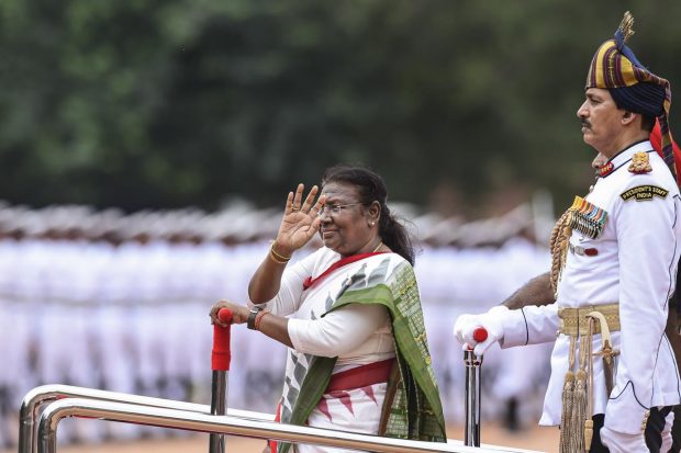 Murmu was given a 21-gun salute after which she signed the oath register amid a thunderous applause and thumping of desks. (PTI Photo)