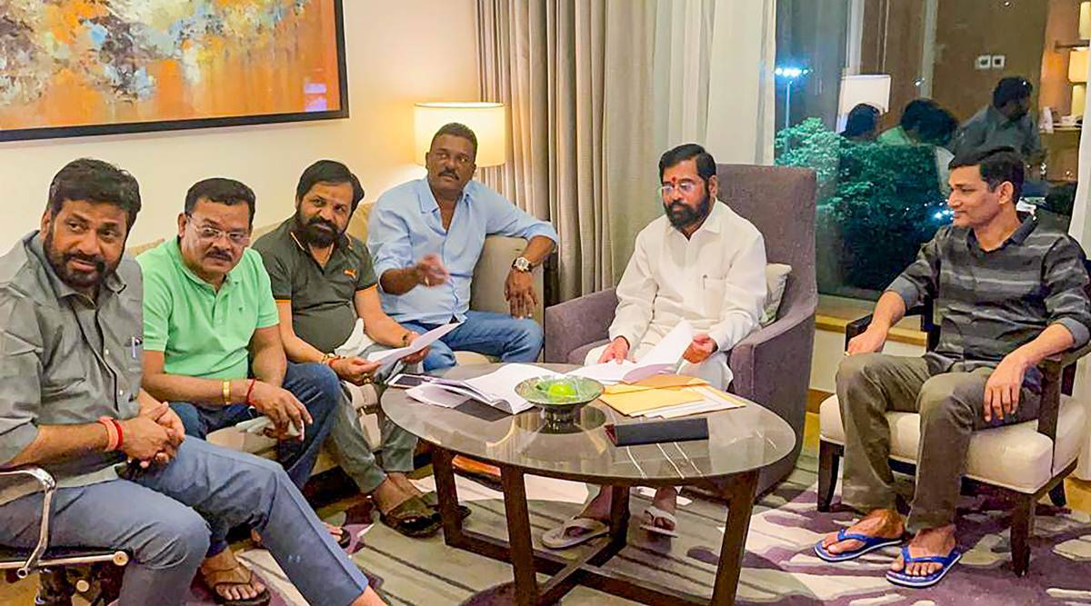 Eknath Shinde with rebel MLAs in Guwahati (PTI) Eknath Shinde with rebel MLAs in Guwahati (PTI)