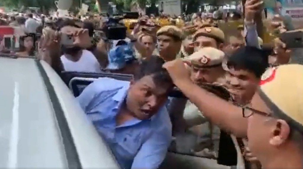 On camera, Congress leader Srinivas's hair pulled. (ANI video screengrab)