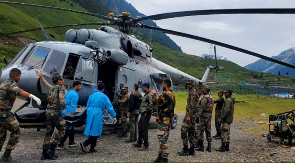 The bodies have been moved from the cave to Nilagrar while stranded yatris are being escorted by the Indian Army personnel up to Baltal, since the track is slushy and slippery. (Photo: Twitter/ PR
