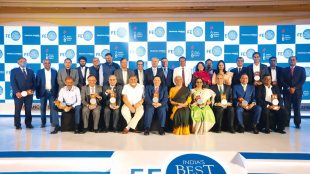 Finance & corporate affairs minister Nirmala Sitharaman with winners of the FE Best Banks awards and others in Mumbai on Friday. The minister said digital payments like UPI can’t be charged as yet as they deliver a ‘public good’ (Express Photo team)