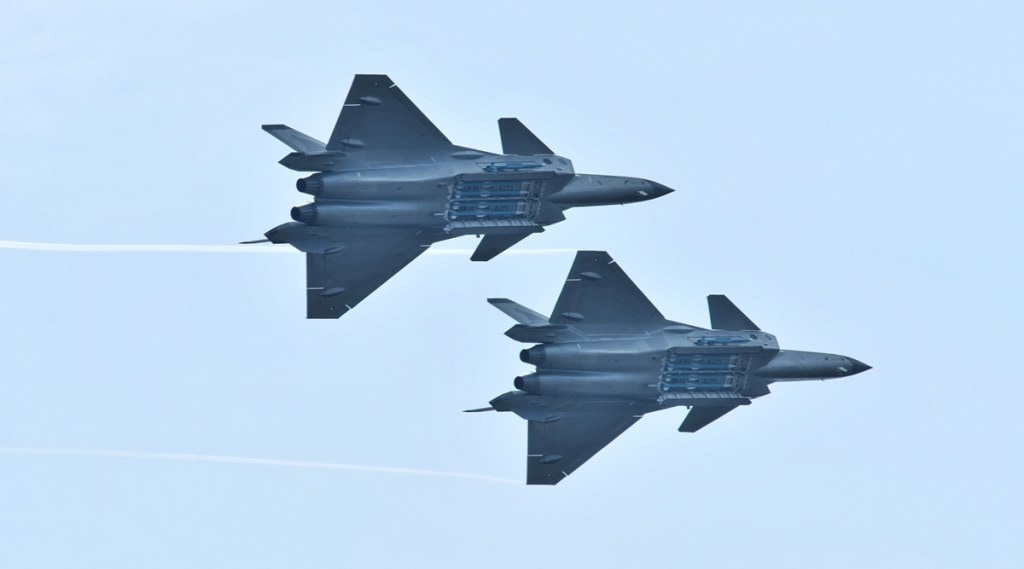 J-20 stealth fighters of PLA Air Force perform with open weapon bays during the Zhuhai Airshow