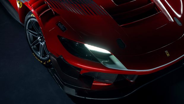 At the front, one can see that the headlamp design is similar to that of the road-going car. While the hood of the 296 GTB is largely smooth and undisturbed by any slats or scoops, such is not the case with the 296 GT3. It even gets a couple of vents on top of the wheel arches at the front. There are two fins on either side and the lower edge of the car is basically a large splitter.