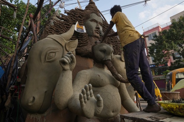 An artisan prepares an eco-friendly idol of elephant-headed Hindu god Ganesha ahead of Ganesh Chaturthi festival in Hyderabad, India, Wednesday, Aug. 17, 2022. (AP Photo)